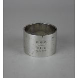 A George VI silver serviette ring with inscription RGO from OMS Sept 1940, an accompanying note