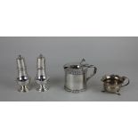 A George VI silver mustard pot cylindrical shape with domed hinged lid and blue glass liner,