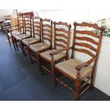 A set of six oak ladderback dining chairs to include two carvers, with rush seats