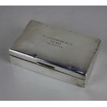 An Elizabeth II silver rectangular cigarette box with presentation inscription (a/f) maker E & N