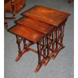 A mahogany nest of three rectangular side tables on turned supports 51cm