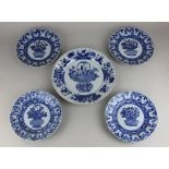 Four Chinese blue and white porcelain plates and a larger example each with similar floral