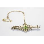 A peridot and seed pearl bar brooch, in 15ct gold, gross weight 3.5g