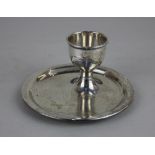 A George V silver egg cup on dished circular base engraved 'Angela', London 1928, maker P J Finch