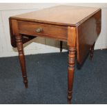 A 19th century mahogany Pembroke table with end drawer and opposing dummy drawer, two drop flaps