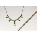 A peridot drop necklace and bracelet, the stones collet set in sterling silver, necklace 43cm