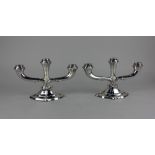 A pair of German 925 silver three branch candlesticks with detachable sconces on loaded bases, ht