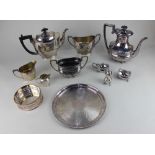 A silver plated three piece tea set oval form with engraved decoration, together with a plated three