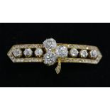 An old cut and rose cut diamond bar brooch, the central three-stone clover set with old mine cut
