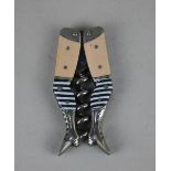 A German novelty ladies legs pocket corkscrew with pale coloured thighs and blue and white striped