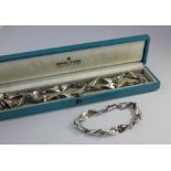 A Georg Jensen sterling silver necklace and bracelet set designed by Edvard Kindt-Larson, No.104A,