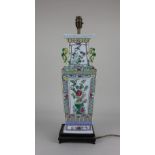 A Chinese porcelain vase of square form, converted to a table lamp on wooden stand, decorated with