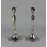 A pair Viennese silver candlesticks vase shaped sconces on flared bases cast with harebell flowers