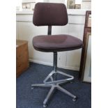 An office swivel chair with adjustable back rest and seat on steel supports with foot rest
