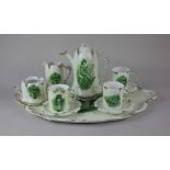 A Rosenthal porcelain 'Sevres' coffee set decorated in green with vignettes of women and children,
