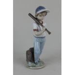 A Lladro porcelain figure of a boy with a baseball bat No 7.610 Dispuesto a jugar, 21.5cm high,