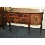A Sheraton style crossbanded mahogany breakfront sideboard with two central drawers flanked by two
