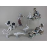 A collection of Lladro porcelain figures comprising a clown playing a violin, 21cm high, a