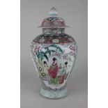 A Chinese porcelain jar and cover decorated with panels of figures and flowers, character marks to