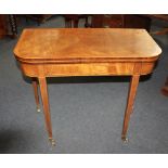 A Sheraton style mahogany card table with crossbanded D shaped fold over top with green baize top on