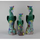 A pair of Chinese ceramic models of Ho-Ho birds, and another similar tallest 40.5cm high (a/f)