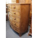A Victorian mahogany bowfront chest of two short over four long drawers with knob handles on splayed