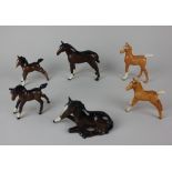 A collection of six Beswick models of foals to include two Palomino tallest 11.5cm high (a/f)