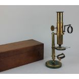 A brass microscope in part case (a/f)