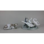 A Lladro figure group of three geese 15cm high, together with a Lladro figure of a recumbent cow 6.