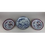 A pair of Chinese porcelain plates decorated with a landscape in blue, red and gilt 22cm diameter,