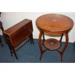 An Edwardian mahogany inlaid occasional table with circular top and under tier on slender cabriole