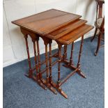 A mahogany nest of three rectangular occasional tables with turned supports 51cm