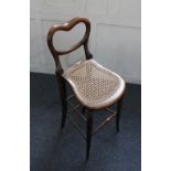 LOT WITHDRAWN A Victorian balloon back music chair and mahogany music stand,