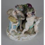A Meissen porcelain figure group representing the four seasons, blue crossed swords mark and incised