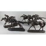 After Tom Mackie, a bronzed resin figure group of two jockeys and race horses, 24cm high, together