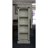 A white painted narrow bookcase inscribed 'Bibliotheque', 60cm wide 171cm high