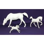 A Beswick model horse and foal in matt white, horse 15cm high, together with a dappled grey foal 7cm