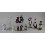 A collection of ten various porcelain, bisque and pottery figures to include a Chelsea style figures