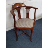 An Edwardian inlaid corner chair with pierced splat back and striped upholstered seat on cabriole