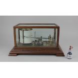 LOT WITHDRAWN A brass barograph in glazed oak case, case 37.5cm by 22cm including base