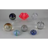 A collection of eight glass paperweights to include Kosta Boda pink 'Hot Lips', Caithness 'Wise