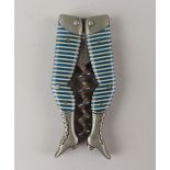 A German novelty ladies legs pocket corkscrew blue and white striped stockings, bladed worm