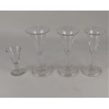 Three conical shaped wine glasses with plain tear drop stem on circular folded foot, 17cm and