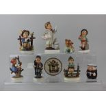 A collection of seven Goebel Hummel porcelain figures to include the Little Pharmacist 15cm high,