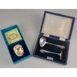 A cased silver christening spoon and pusher set hallmaked Sheffield 1953 and a cased Bilston and