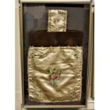 A framed 19th century and later needlework bag, with floral decoration, frame 57cm by 36.5cm, by