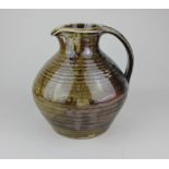 David Leach (1911-2005) for Leach Pottery, a glazed stoneware jug of bellied form, with impressed