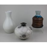 Tim Andrews (b 1960), three vases comprising one raku fired 13cm high, one with incised copper