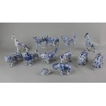 A collection of twelve Delft style tin glazed pottery figures of animals to include giraffes,