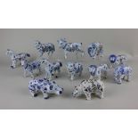 A collection of twelve Delft style tin glazed pottery animals to include elephants, goats, sheep and